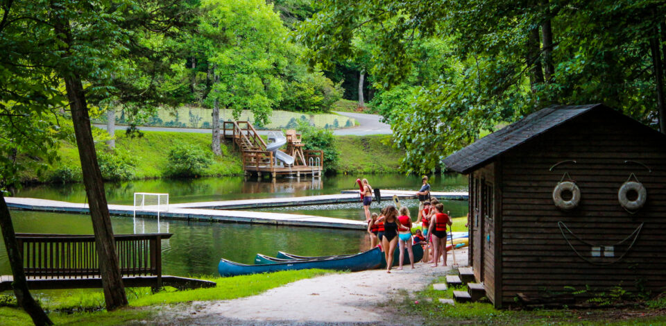 Campers prepare for a canoe lesson on friendship lake.