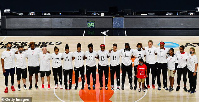 After the WNBA announcement of the postponed games for the evening, the Washington Mystics each wear white T-shirts with seven bullets on the back protesting the shooting of Jacob Blake by Kenosha, Wisconsin police in Palmetto, Florida