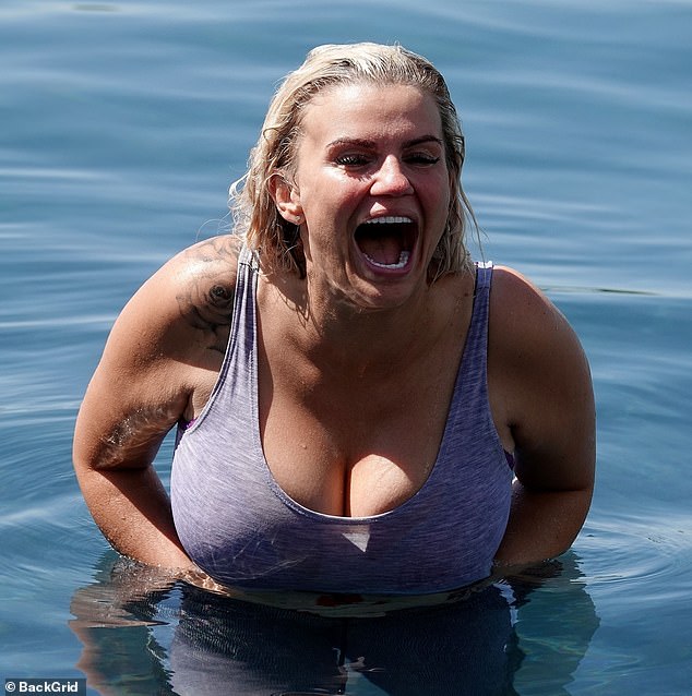 Happy: Kerry Katona, 39, looked to be in good spirits as she took an unexpected dip in the pool at the resort in Granada, Spain, on Friday
