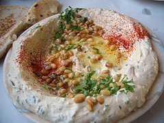 israel restaurants serve hummus with pine nuts tznobar - classic dish
