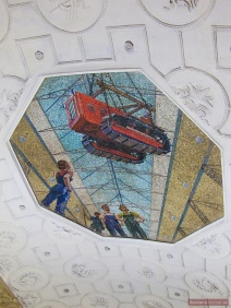 Ceiling mosaic with red tractor of Novokuznetskaya Metro Station in Moscow